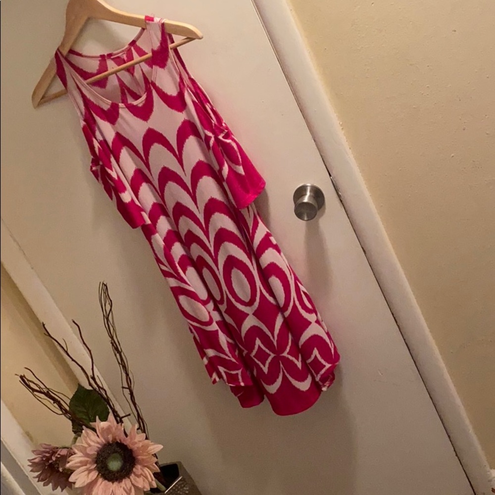 Patterned dress with shoulders out.